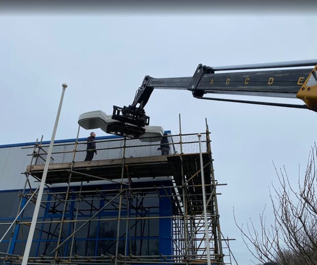 An image of a sign being installed.